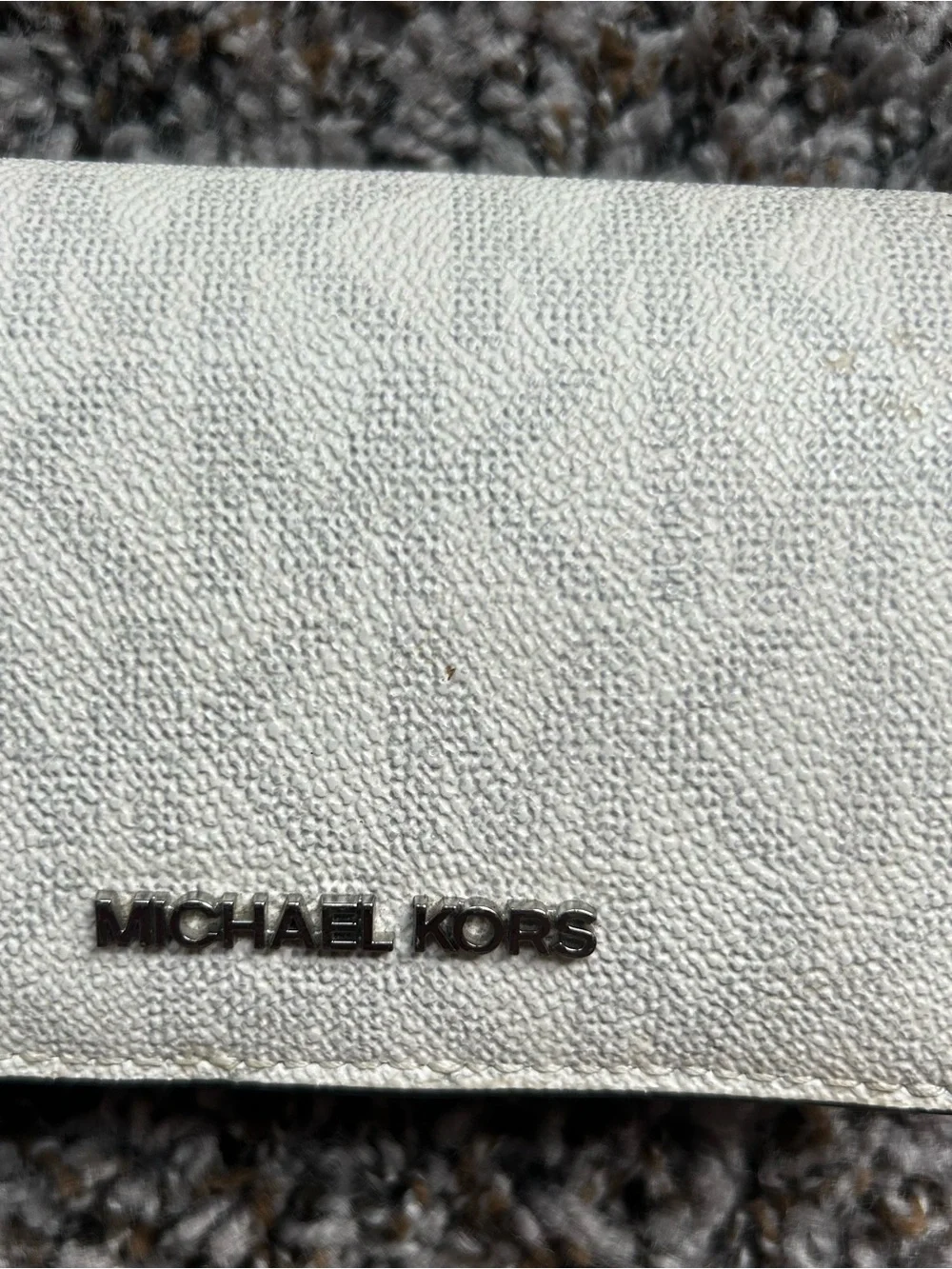 Michael Kors Pebbled Leather Fold-Over Wallet in Off-White with Silver Logo